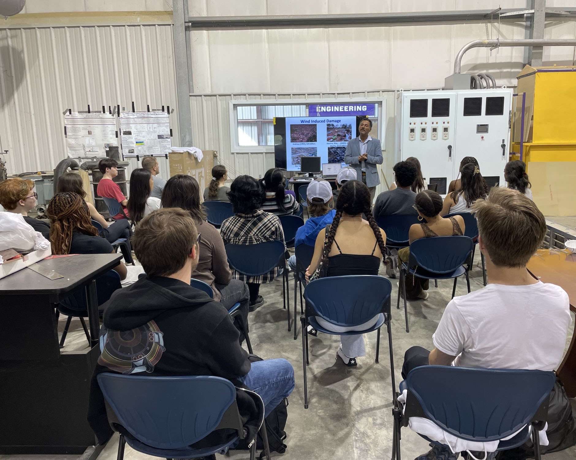 LSU associate professor Aly Mousaad Aly meets with students in the wind-testing lab