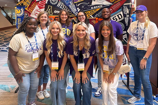 BAP students and advisor take a group photo at at national conference. 