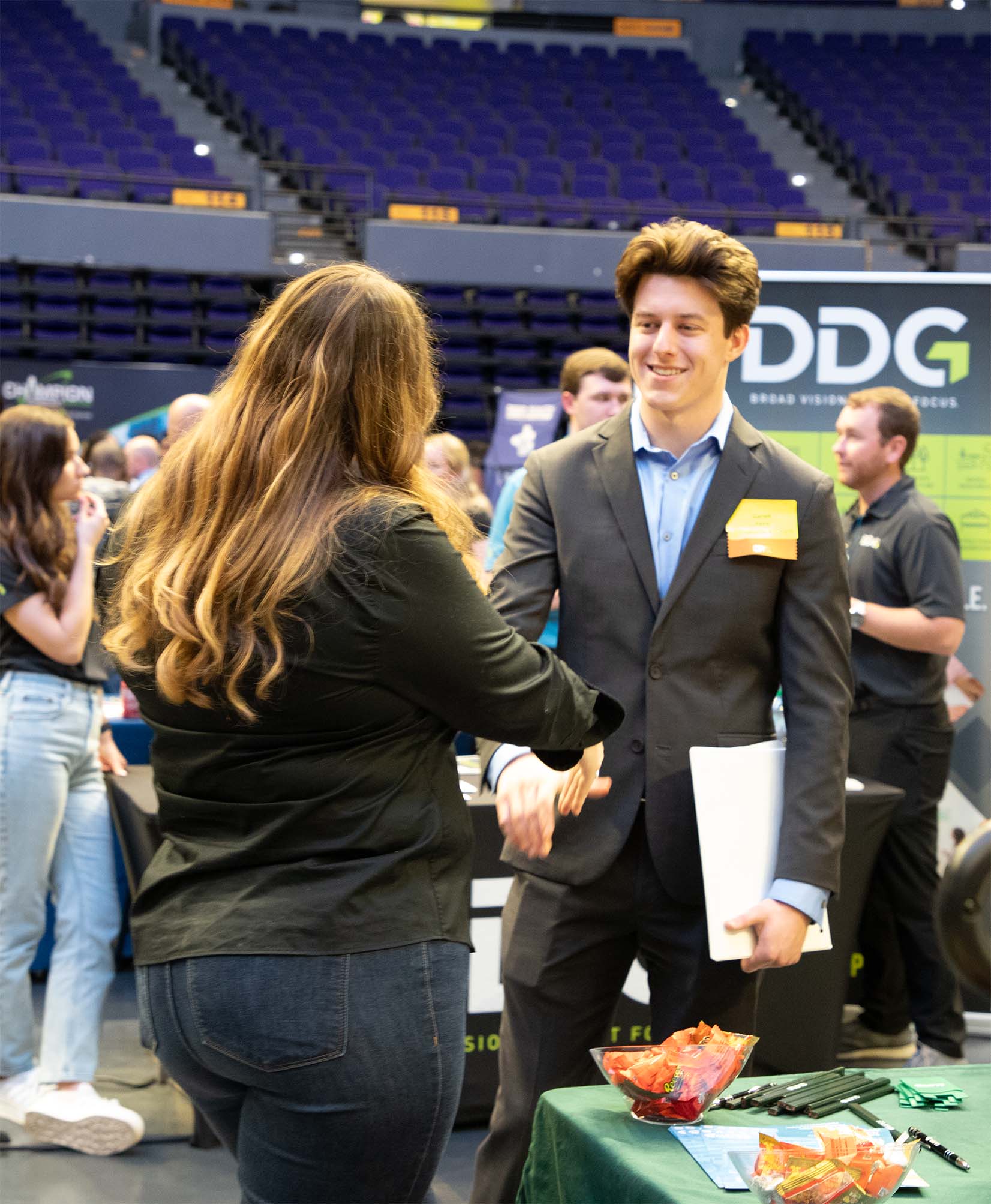 Person networking at career fair.