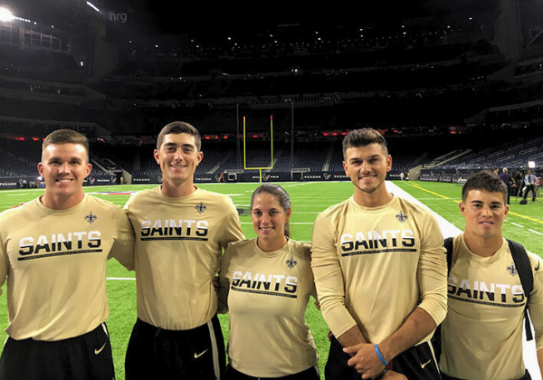 Students at an internship with the New Orleans Saint